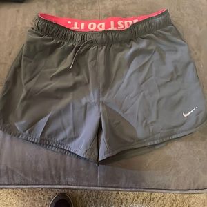 Gray Nike shorts with pink spandex inside - Size Small - $5